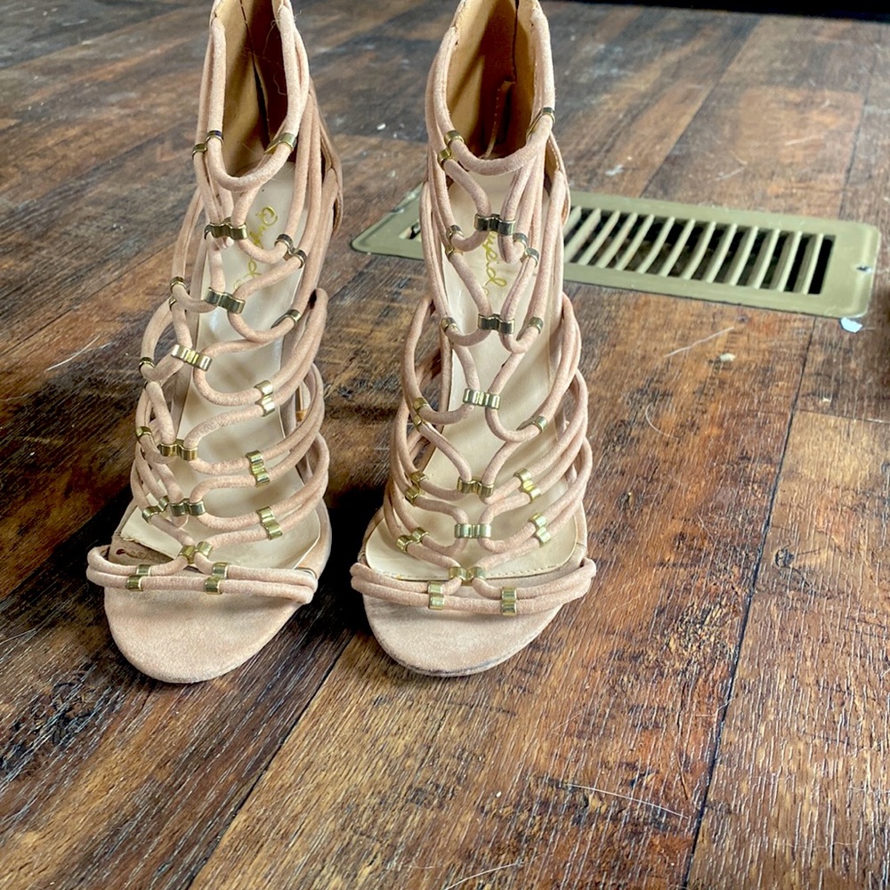 Nude high heels with gold accents